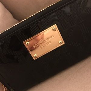 Michael Kors pat and leather logo wristlet.